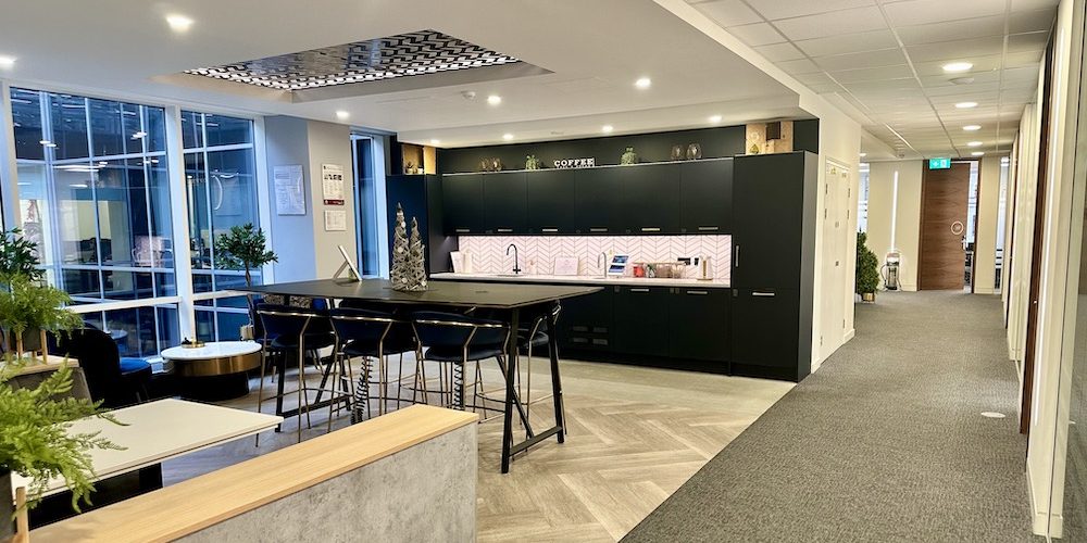 Office breakout area with kitchen and bench seating