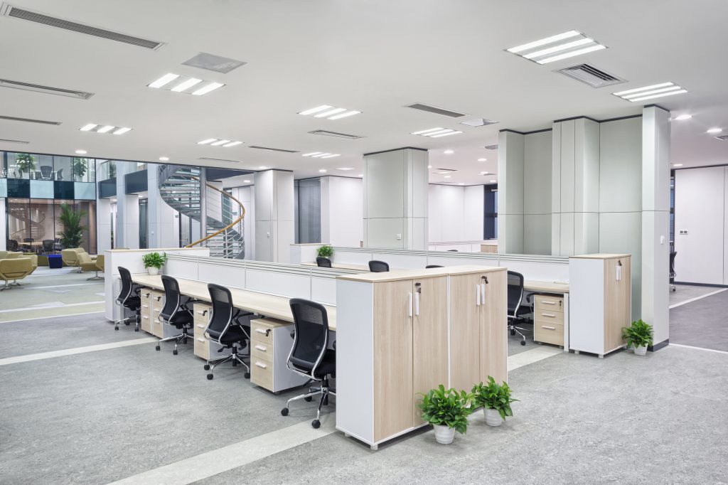 Open-plan office with desks and storage units