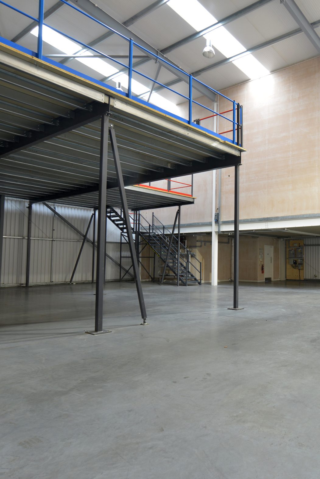 Steel mezzanine floor with staircase in a commercial unit