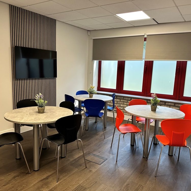 Breakout area with café tables after a full office refit, Bristol